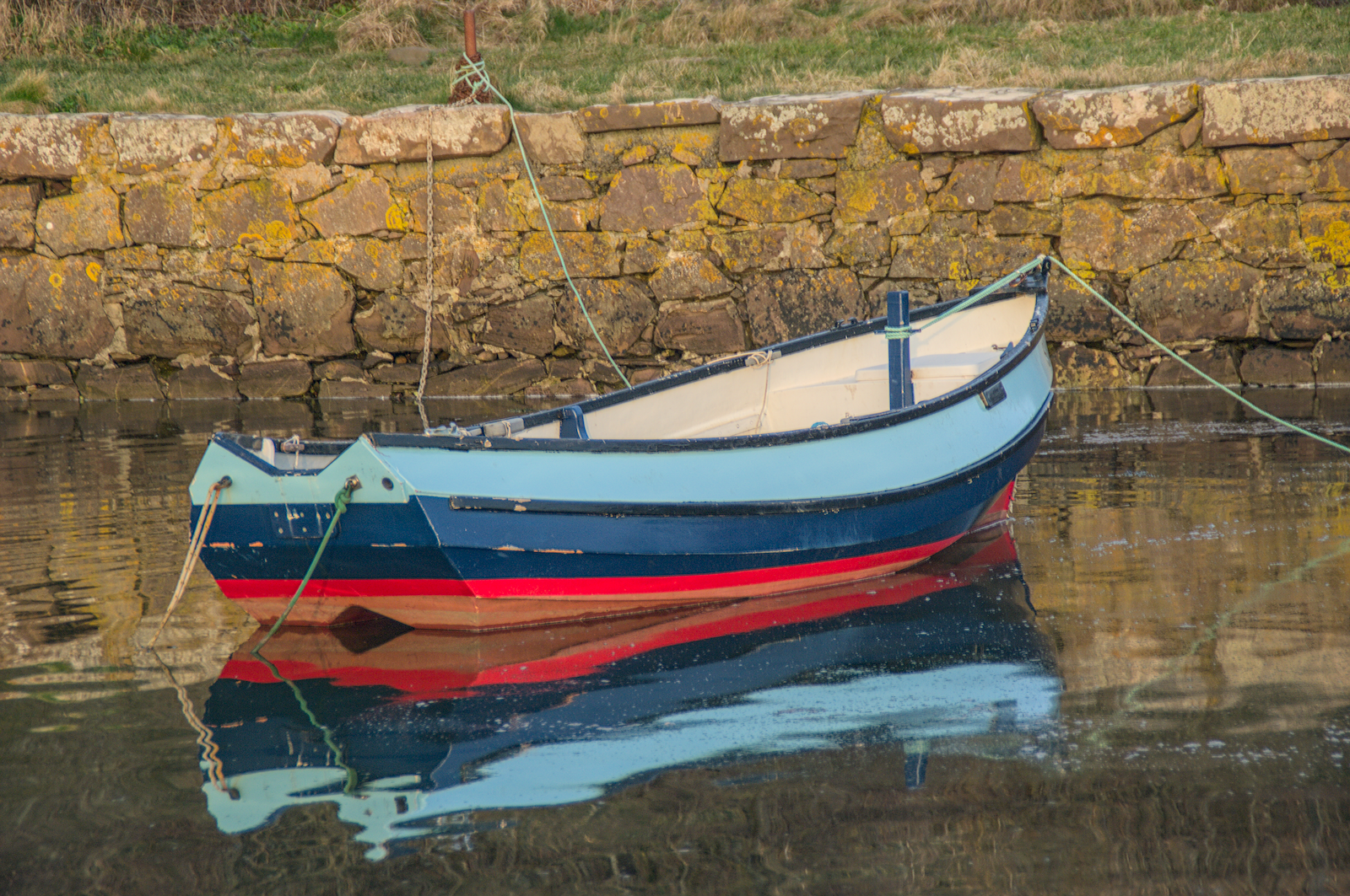 Rowing boat on calm water